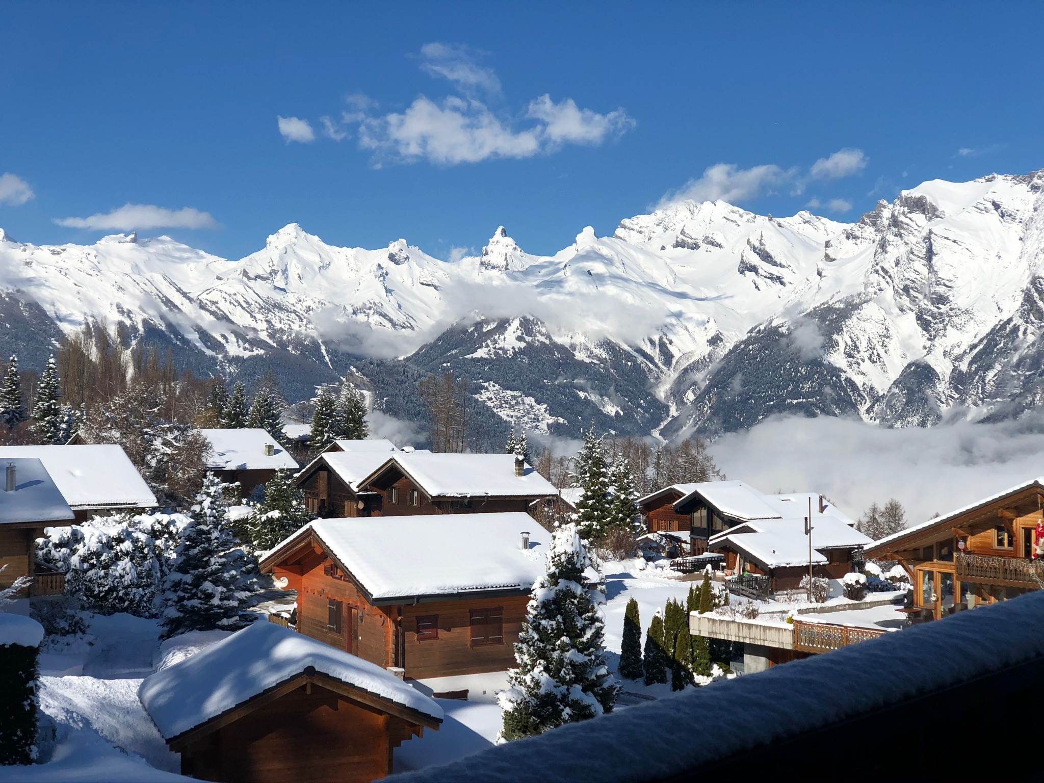 Winter panorama over the village to the Alps