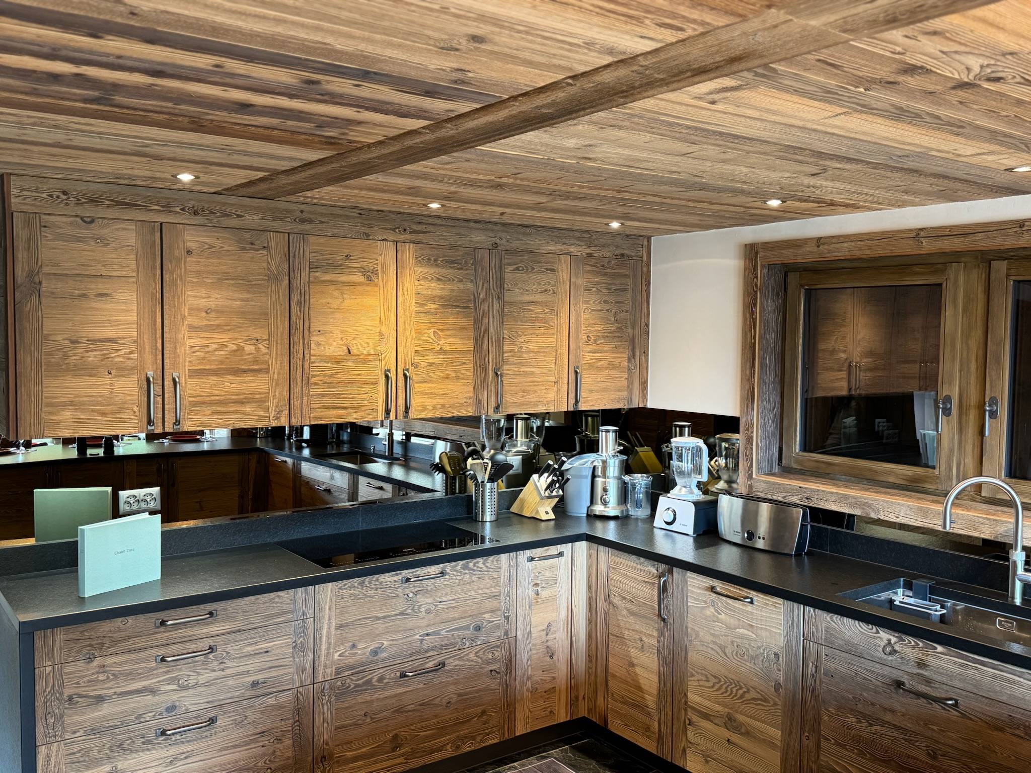 The main kitchen: old larch and black stone