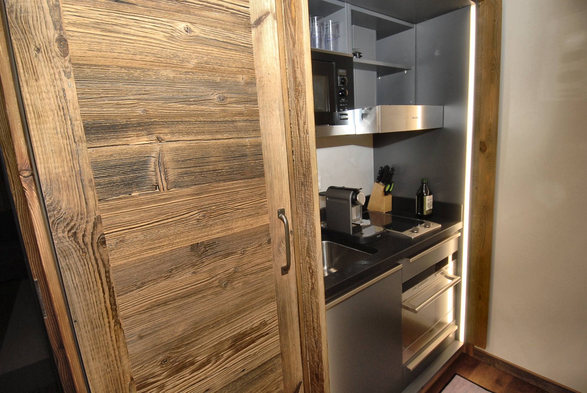 The second kitchen, closed behind its larch doors