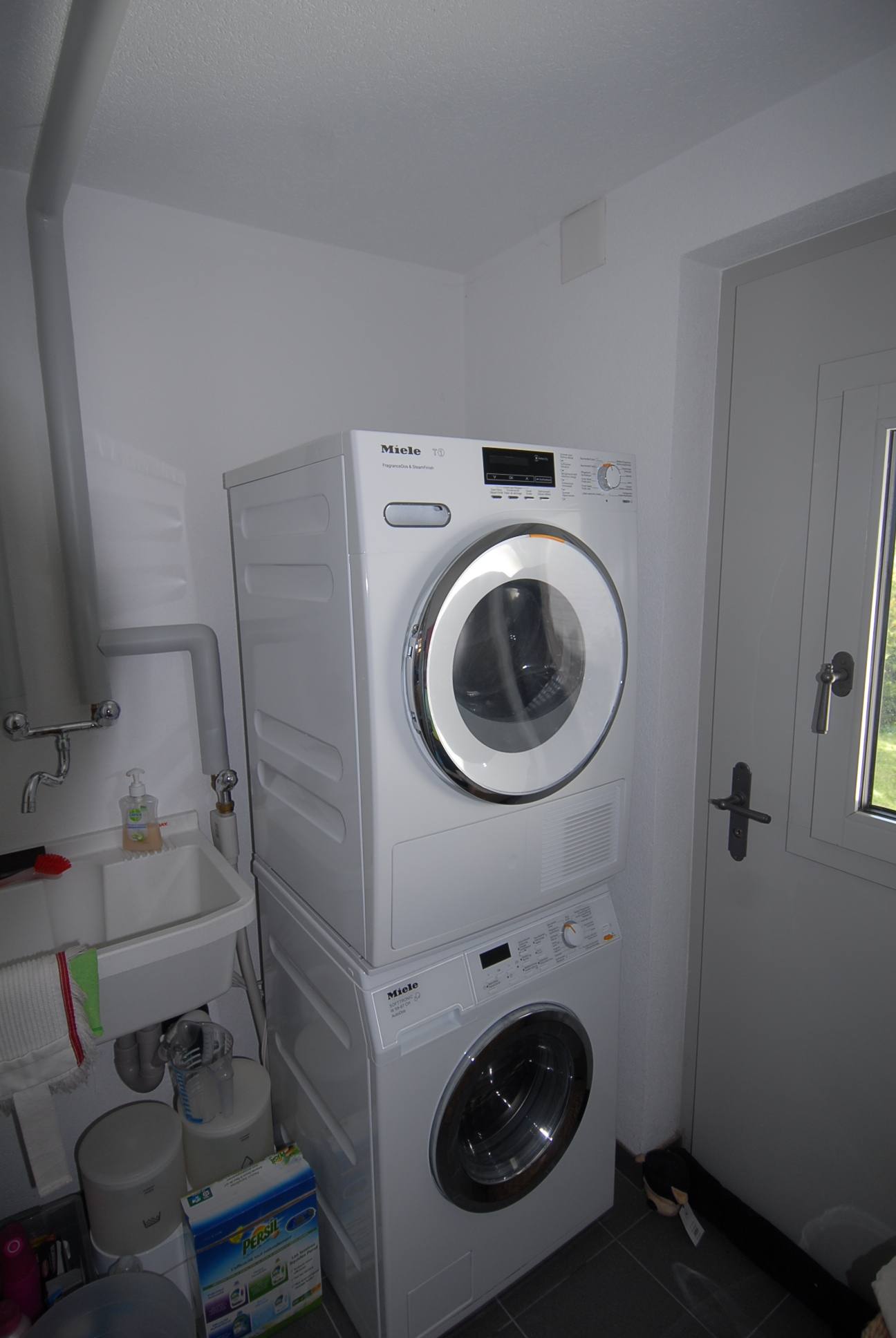 Utility room with washer and dryer